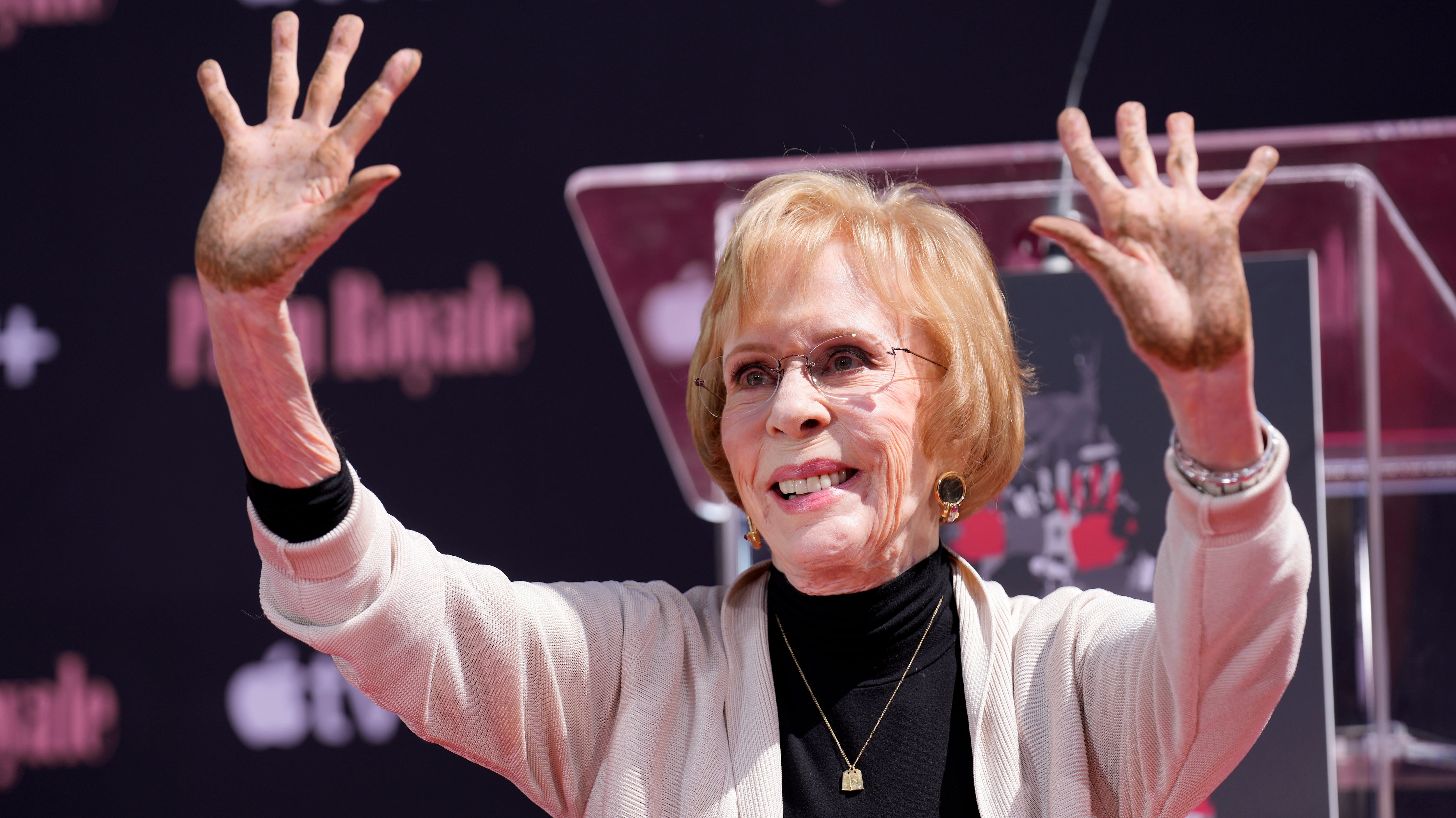 Comedian Carol Burnett holds up her hands after putting them in cement during a ceremony for her at the TCL Chinese Theatre AP Photo/Chris Pizzello)