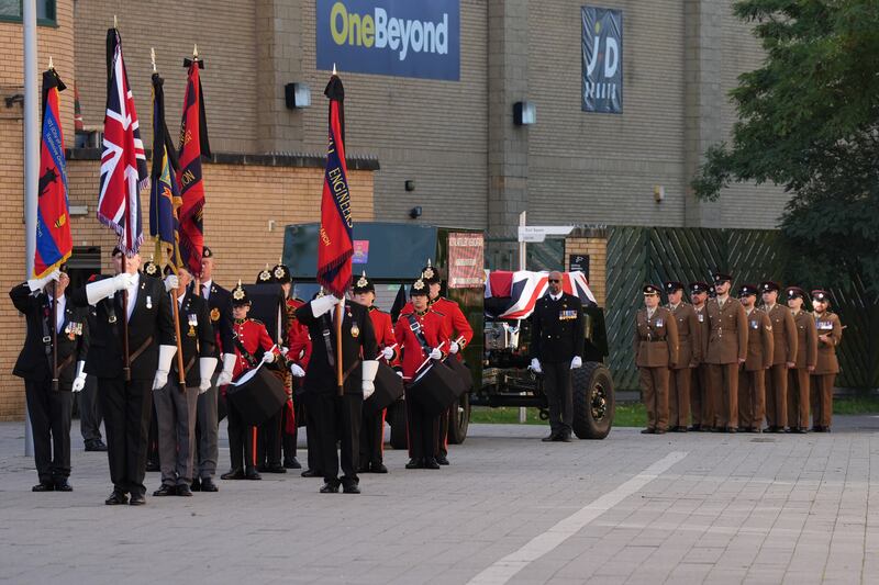 The coffin is escorted by members of the armed forces and veterans to St Martin’s Church in Basildon