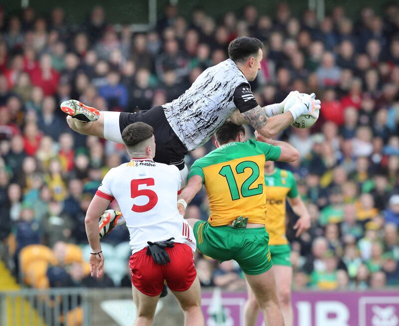 Tyrone keeper Niall Morgan collects the incoming ball over Daire O'Baoill of Donegal during the All Ireland Senior Football Championship match played at Ballybofey on Saturday 25th May 2024.  Picture Margaret McLaughlin