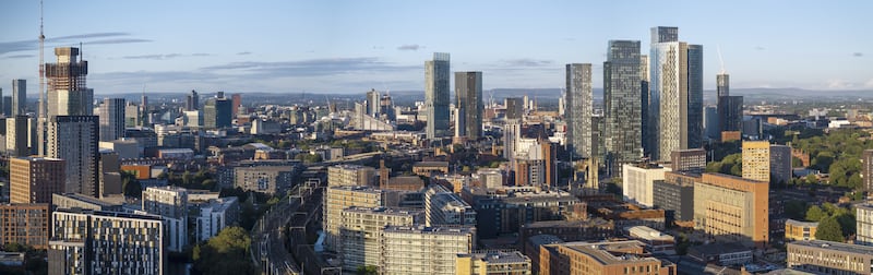 Aerial view of Manchester skyline with old and new buildings