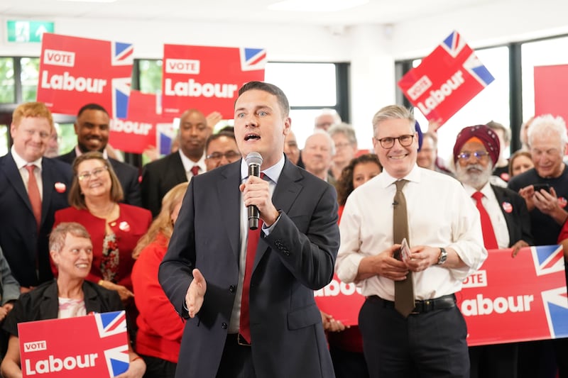 Sir Keir Starmer looks on as Wes Streeting gives a speech on the General Election campaign trail