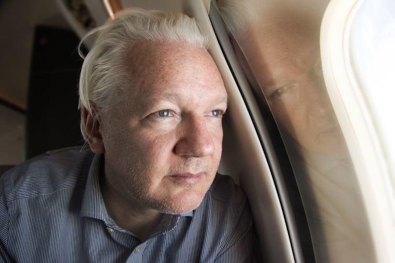 Julian Assange on board a flight to Bangkok, Thailand, following his release from prison