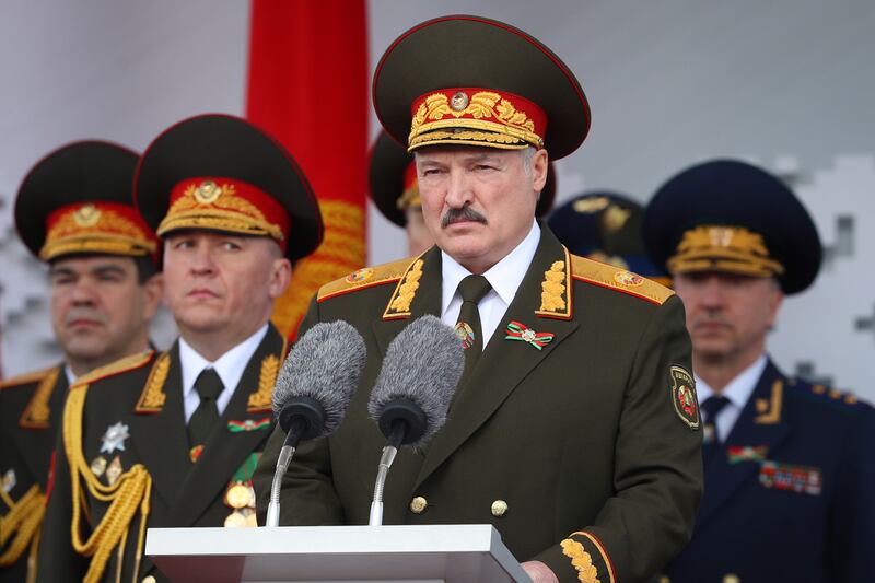 Mr Lukashenko, centre, gives a speech during a military parade in 2020 (Belarusian Presidential Press Service via AP)
