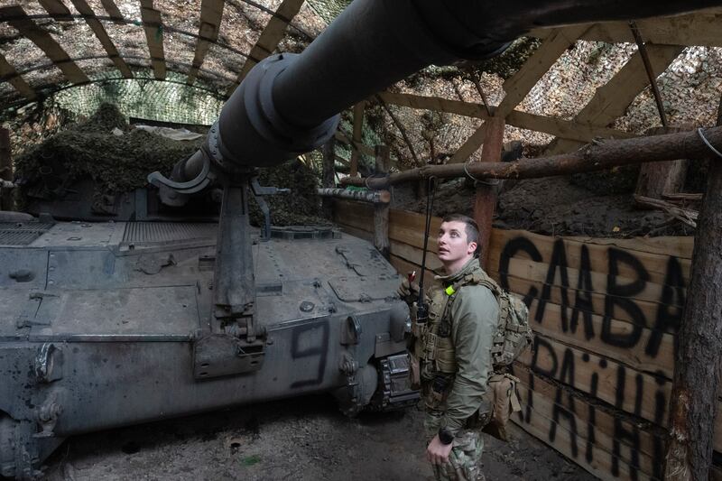 Ukrainian officer of the 92nd separate assault brigade inspects a 155mm M-109 Paladin howitzer on the frontline near Vovchansk (AP Photo/Efrem Lukatsky)