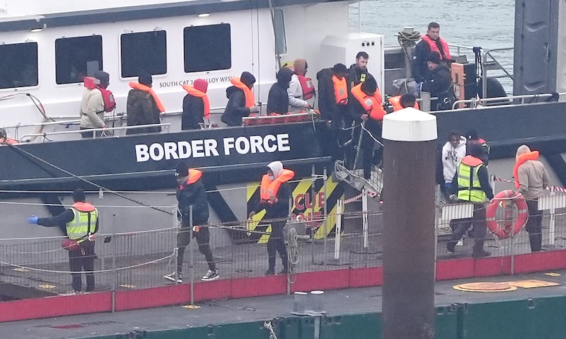 A group of people thought to be migrants are brought in to Dover, Kent, from a Border Force vessel following a small boat incident in the Channel