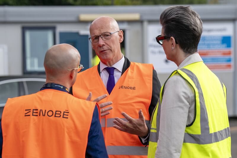 First Minister John Swinney (centre) has been urged to intervene, after talks involving his Finance Secretary Shona Robison failed to find a deal.