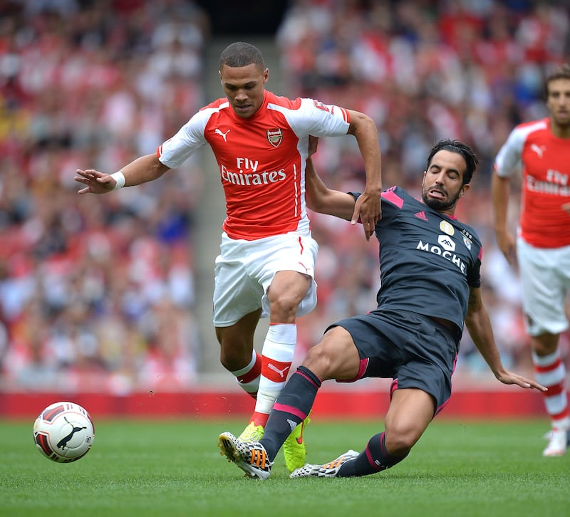 Amorim (right) challenges Arsenal’s Kieran Gibbs for the ball at the Emirates Stadium in 2014 .