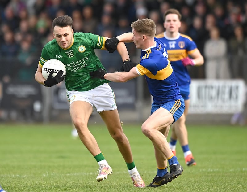 Dungannon Clarke's star Paul Donaghy is challenged by Donaghmore defender Ben Hughes.