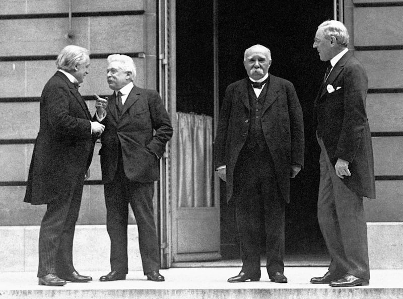 Left to right, Prime Minister David Lloyd George, Vittorio Orlando of Italy, Prime Minister Georges Clemenceau of France, and President Woodrow Wilson of the United States of America, after the signing of the official peace treaty at the Palace of Versailles