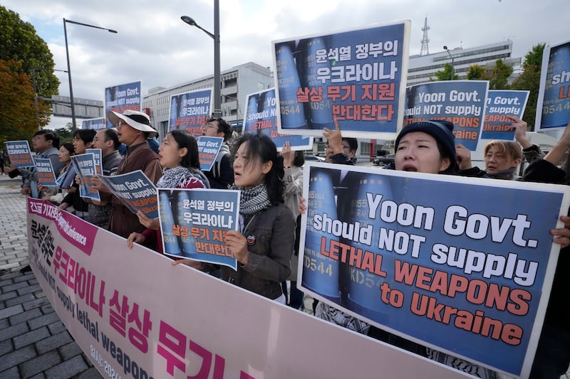 South Korean protesters stage a rally against their government’s plans to supply lethal weapons to Ukraine (AP)