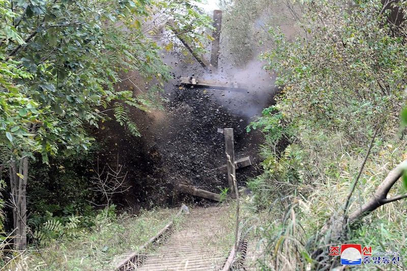 North Korean government picture showing the demolition of parts of the northern sections of unused road and rail links that once connected the country with the South (Korean Central News Agency/Korea News Service/AP)