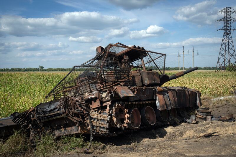 A destroyed Russian tank on a roadside near the town of Sudzha in the Kursk region (AP)