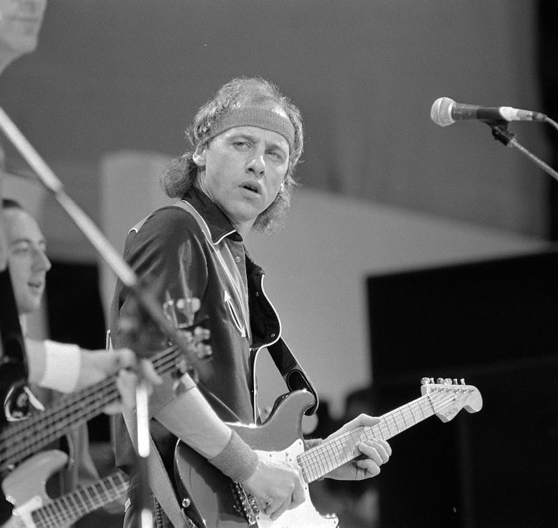 Mark Knopfler performing with Dire Straits at Live Aid at Wembley Stadium in July 1985