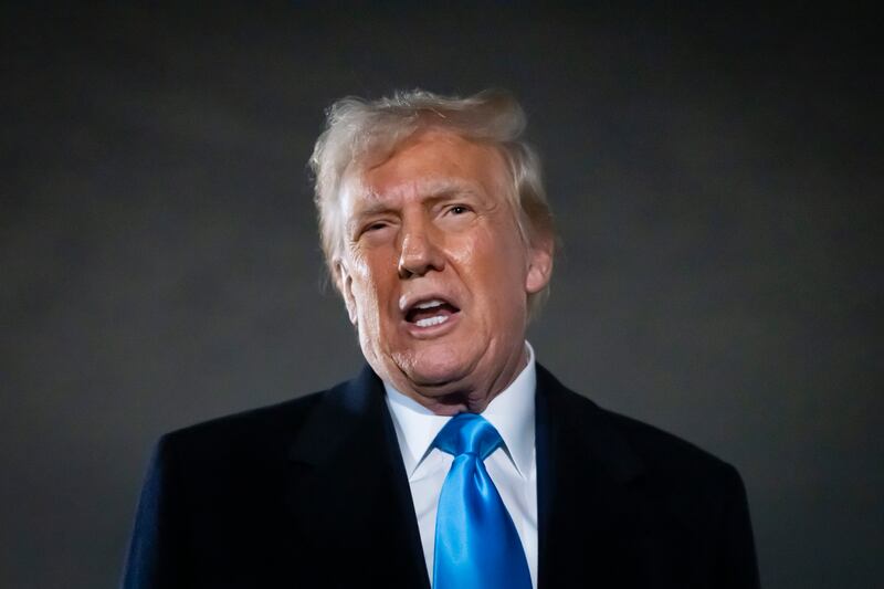 President Donald Trump speaks to reporters next to Air Force One (AP/Ben Curtis)