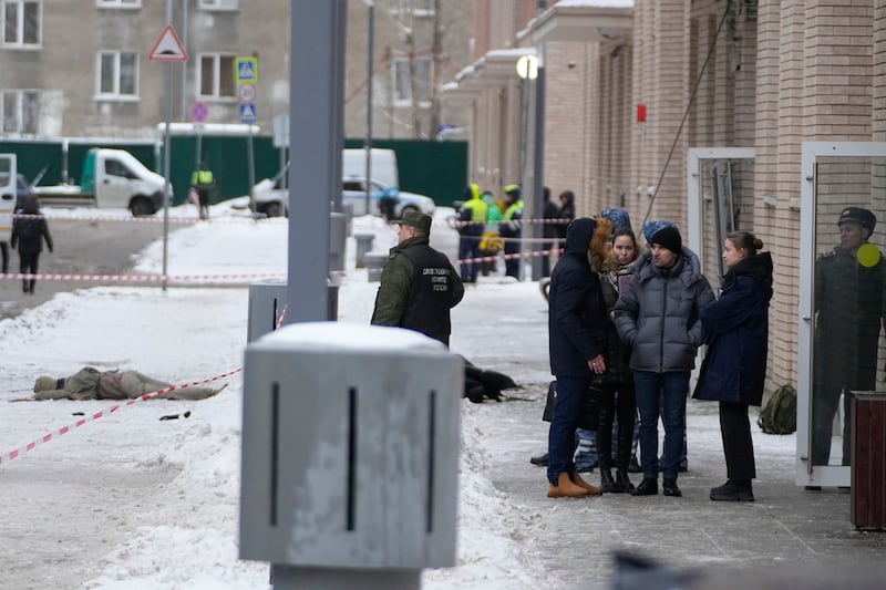 Investigators work at the site of the explosion (AP)