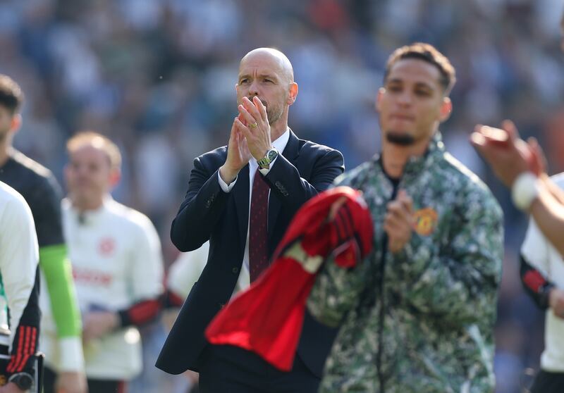 Manchester United manager Erik ten Hag applauds the fans after victory at Brighton