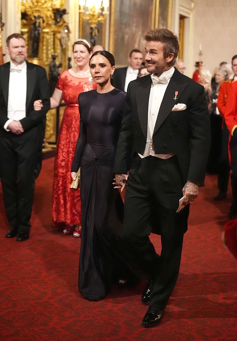 David and Victoria Beckham make their way along the East Gallery