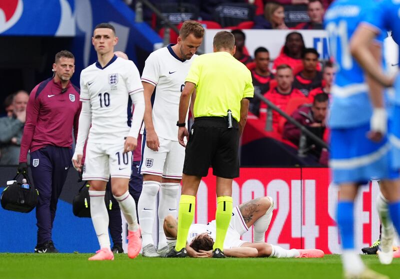 England’s John Stones lies in pain after an early challenge during the Iceland friendly.