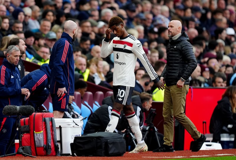 Rashford (centre) was withdrawn after being lucky to escape a second booking