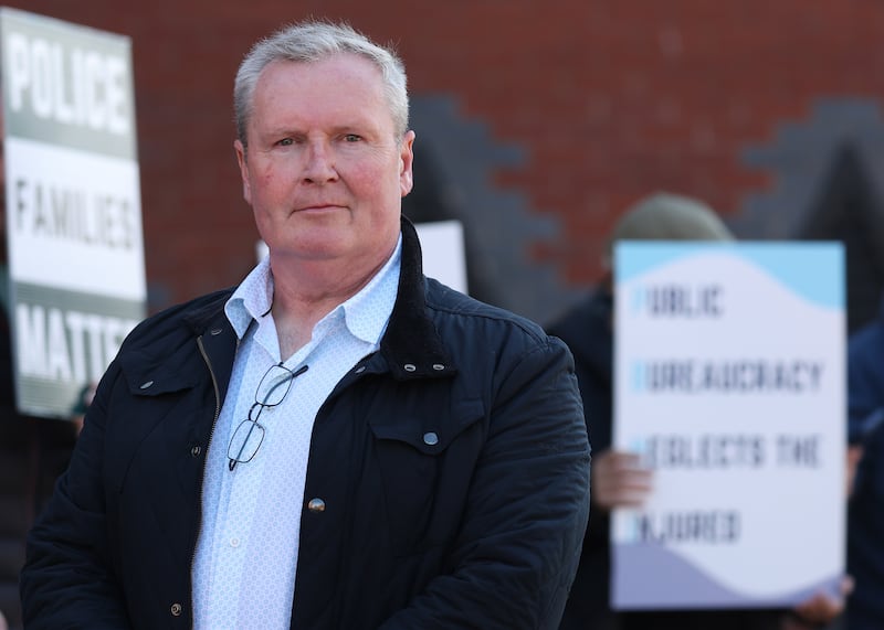 Blue lights chair, Alan Gawne with other protesters outside the policing board office on Thursday.
PICTURE COLM LENAGHAN