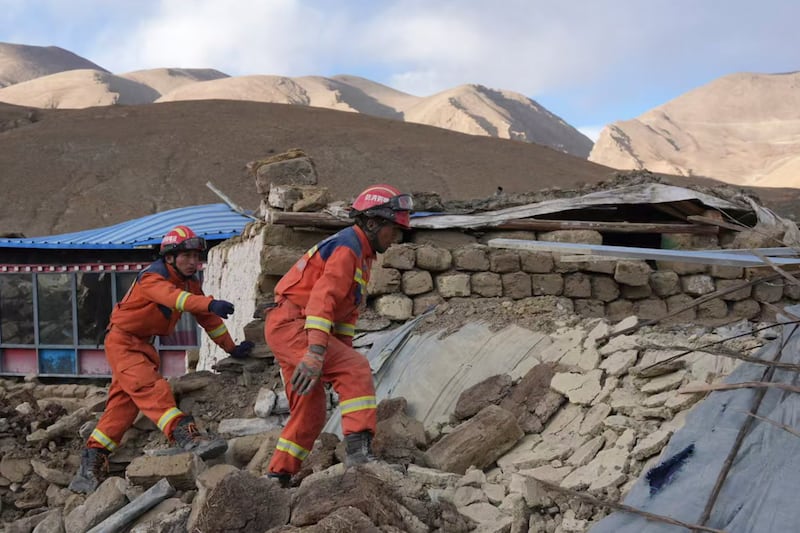 In this photo released by Xinhua News Agency, rescue workers conduct search and rescue for survivors in the aftermath of an earthquake in Changsuo Township of Dingri in Xigaze (Jigme Dorje/Xinhua/AP)