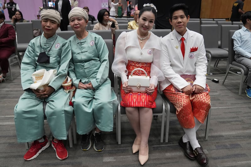 Couples wait for their marriage certificates in Bangkok (Sakchai Lalit/AP)