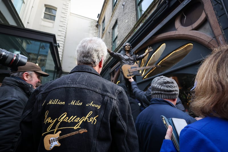 A commemorative statue of legendary composer and musician Rory Gallagher was revealed today at Ulster Hall, honouring his life, music, and his deep connection to Belfast. 
Crafted by renowned sculptors Anto Brennan, Jessica Checkley of Bronze Art Ireland, and David O’Brien of Bronze Art Ireland. It is inspired by a January 1972 Melody Maker magazine cover shot of Rory onstage at Ulster Hall. PICTURE: MAL MCCANN