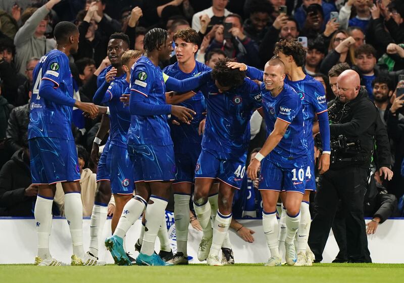 Renato Veiga (centre) celebrates the opening goal