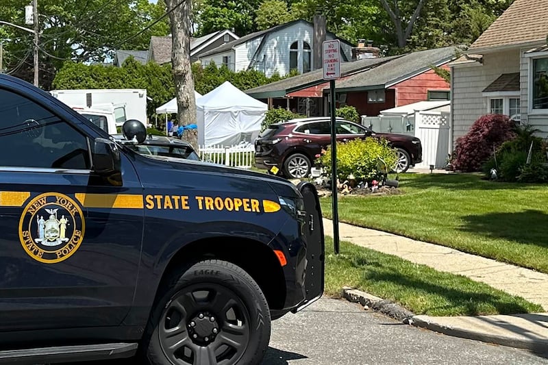 Law enforcement officers at Rex Heuermann’s home (Phil Marcelo/AP)