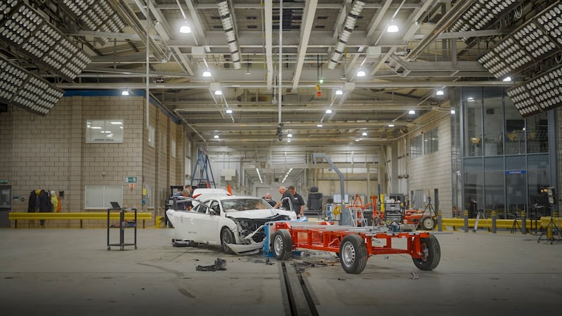 Cars are propelled into a trolley along a runway