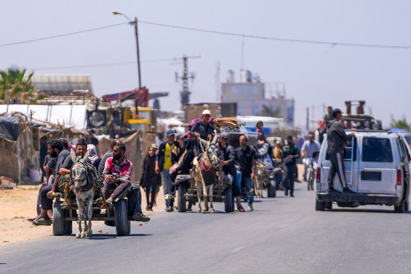 Displaced Palestinians arrive in central Gaza after fleeing from Rafah (Abdel Kareem Hana/AP)