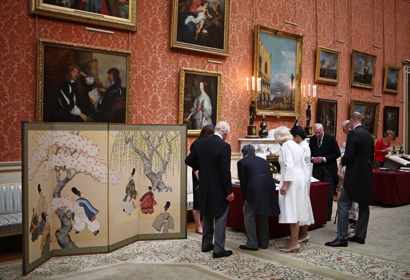 The King and Queen with Emperor Naruhito and his wife Empress Masako view a display of Japanese items from the royal collection at Buckingham Palace