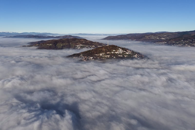 A dense layer of fog and smog has blanketed Sarajevo (Armin Durgut/AP)