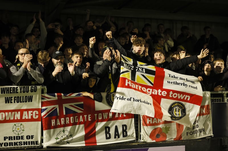 Harrogate fans celebrate their side’s win against Wrexham in the previous round