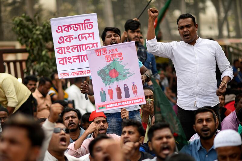 Supporters of Bangladesh’s former prime minister Khaleda Zia and her Bangladesh Nationalist Party shout slogans during an anti-India protest in Dhaka (Mahmud Hossain Opu/AP)