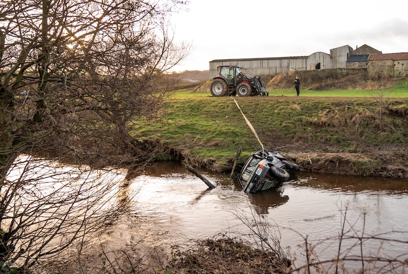 NUMBERPLATE PIXELLATED BY PA PICTURE DESK AT REQUEST OF NORTH YORKSHIRE POLICE The recovered vehicle being removed from the River Esk