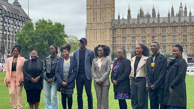 Members of the campaign group World Afro Day (WAD) outside Parliament as they called for Afro hair to be made a protected characteristic under the 2010 Equality Act. .