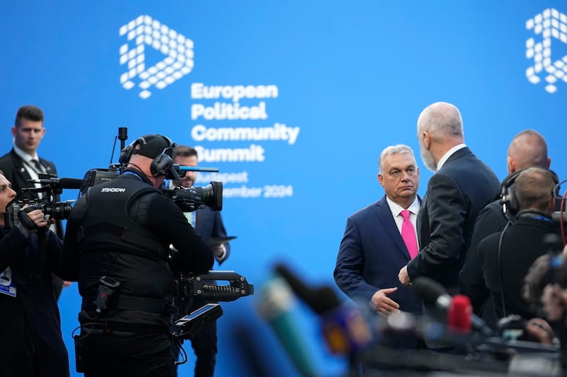 Albania’s Prime Minister Edi Rama, right, speaks with Hungary’s Prime Minister Viktor Orban before the summit (Petr Josek/AP)