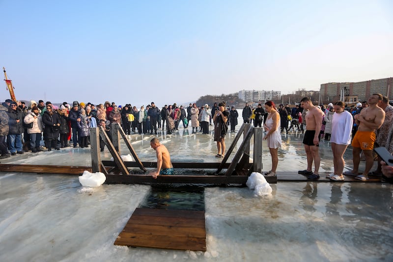 People line up to plunge in icy water in the Russian far east port Vladivostok (AP)