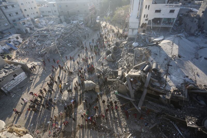 Buildings destroyed by an air strike in Rafah (Hatem Ali/AP)