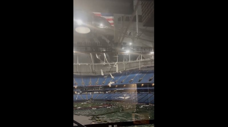 Footage posted online from inside the stadium showed parts of the roof had been ripped apart by Hurricane Milton as the empty temporary beds on the field lie empty (Ryan Stryker / x.com/Stryker175)