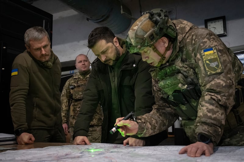 Ukrainian President Volodymyr Zelensky and Roman Mashovets, deputy head of the Presidential Office, during their visit to the front line city of Kupiansk, Kharkiv region (Efrem Lukatsky/AP)