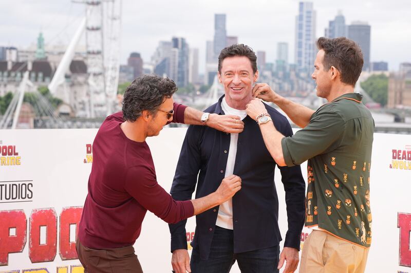Levy, Jackman and Reynolds could be seen fooling around at the photo call