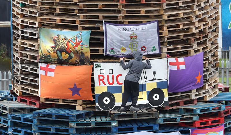 An image of a police vehicle is added to the bonfire currently being built in the Derry Bogside that is due to be lit tonight August 15th. Picture Margaret McLaughlin  15-8-2024