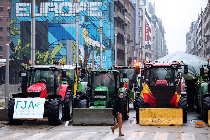 Tractors parked behind a blockade during a protest in Brussels (Nicolas Landemard/AP)