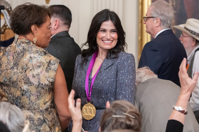 Singer and actor Idina Menzel stands during a National Arts and Humanities Reception in the East Room at the White House in Washington (Mark Schiefelbein/AP)