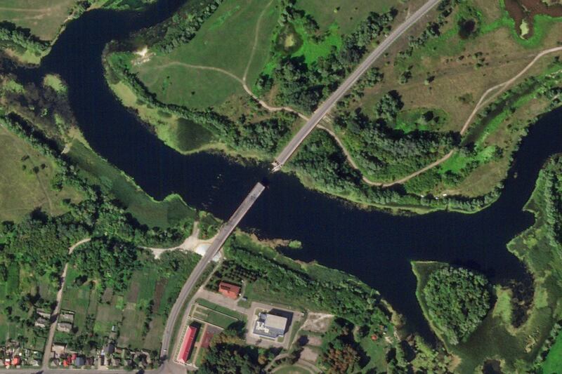 Satellite photo from Planet Labs PBC shows a destroyed bridge across the Seim River at the town of Glushkovo (Planet Labs PBC via AP)