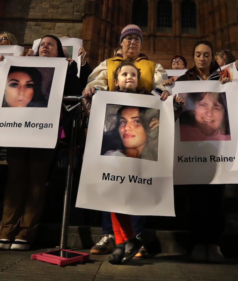 Six years old Anna Taylor holds one of many images of women who have died through violence, during a rally calling for the end of violence against women and girls at Guildhall Square in Derry on Friday night. Picture Margaret McLaughlin 8-11-2024