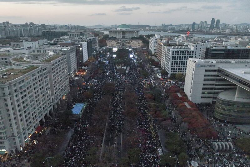 Thousands of people have taken to the streets of Seoul (Yonhap via AP)