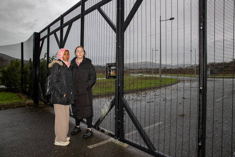 TO BE PUBLISHED at 11am on Wednesday 01 January Marwa Basi (left) with Marissa McMahon from the Participation and Practice of Rights (PPR) from close to the former Mackie International site textile machinery engineering plant and foundry in north Belfast known as Mackie’s. The mother-of-four who escaped war in Sudan and was evicted in Belfast has urged Stormont to build much needed homes on a major vacant site. PA Photo. Picture date: Monday December 17 2024. See PA story ULSTER Homelessness. Photo credit should read: Liam McBurney/PA Wire